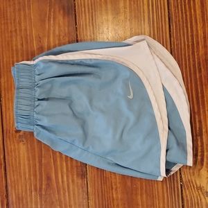 Blue Nike running shorts